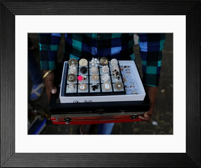 Framed Print : Man sells artificial jewellery at a market in Mumbai Framed Print : Man sells artificial jewellery at a market in Mumbai