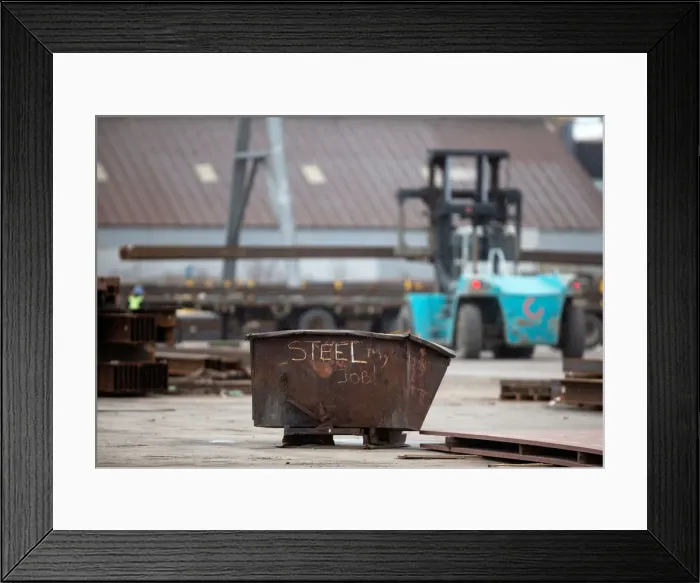 Framed Print : A garbage bin with the words STEEL MY JOB! painted on it sits in a storage yard where Framed Print : A garbage bin with the words STEEL MY JOB! painted on it sits in a storage yard where