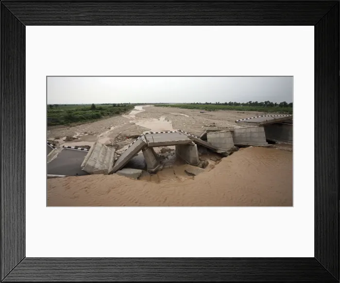 Framed Print : A bridge that was damaged by the flash floods, built over a stream leading to river Tawi