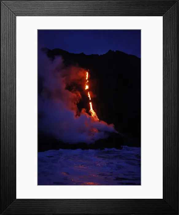 Framed Print : Waves crash over lava as it flows into the ocean near Volcanoes National Park in Kalapana