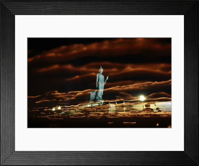 Framed Print : Buddhists carry candles while encircling a large Buddha statue during Vesak Day in Nakhon Framed Print : Buddhists carry candles while encircling a large Buddha statue during Vesak Day in Nakhon