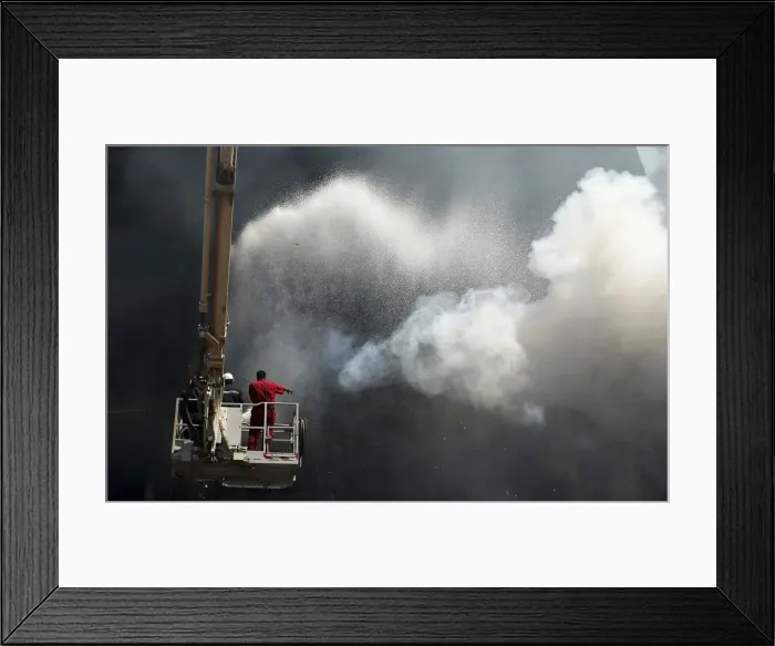 Framed Print : Firefighters work to extinguish blaze at carpet market in Benghazi Framed Print : Firefighters work to extinguish blaze at carpet market in Benghazi