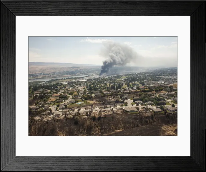 Framed Print : Homes destroyed by the Sleepy Hollow fire are seen as commercial buildings burn in Framed Print : Homes destroyed by the Sleepy Hollow fire are seen as commercial buildings burn in