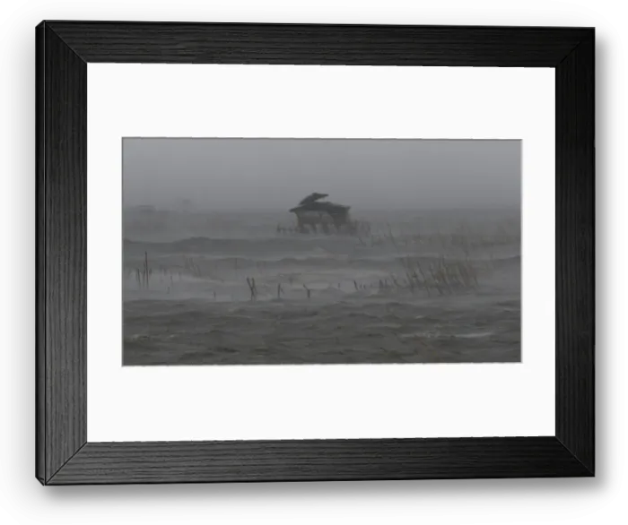 Framed Print : View of fishermans house in the middle of a fish pen as it is pounded by waves Framed Print : View of fishermans house in the middle of a fish pen as it is pounded by waves