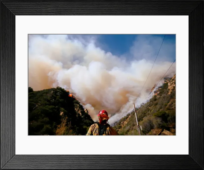 Framed Print : Firefighters battle the Woolsey Fire as it continues to burn in Malibu
