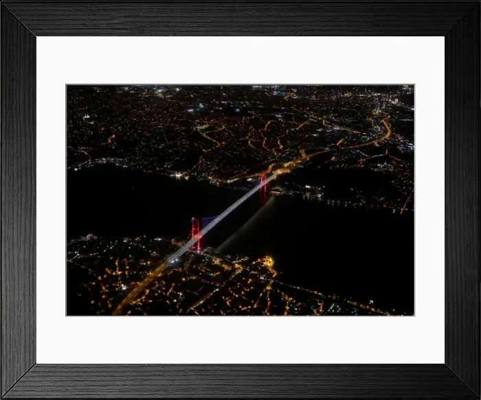 Framed Print : Bosphorus strait and the Fatih Sultan Mehmet Bridge are pictured through the window of a Framed Print : Bosphorus strait and the Fatih Sultan Mehmet Bridge are pictured through the window of a