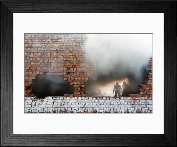 Framed Print : Firefighters try to douse fire that broke out at footwear in New Delhi Framed Print : Firefighters try to douse fire that broke out at footwear in New Delhi