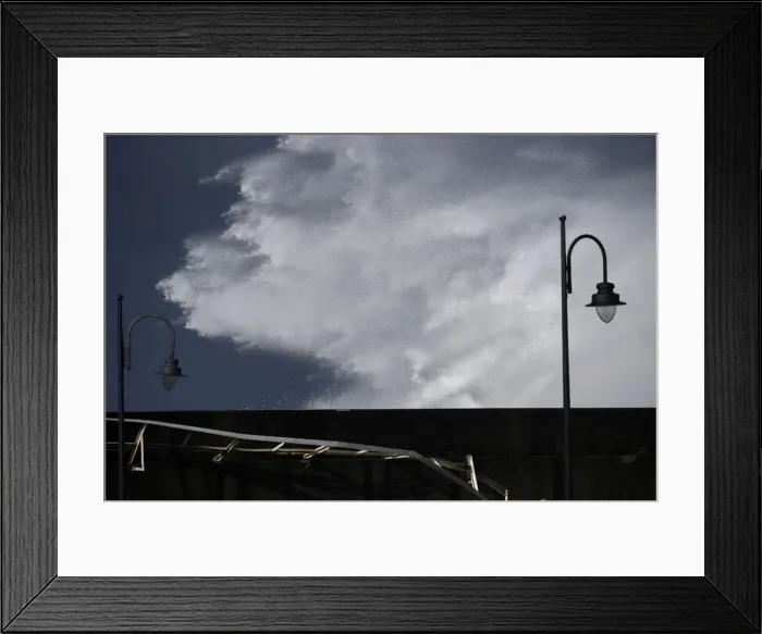 Framed Print : Waves crash against a seafront a the port town of Puerto de Vega
