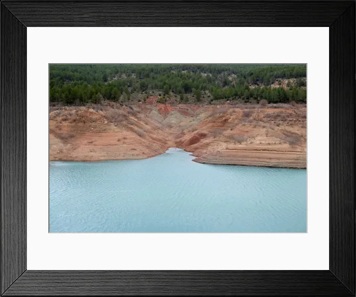 Framed Print : The partially empty Contreras water reservoir is pictured during a severe drought near Framed Print : The partially empty Contreras water reservoir is pictured during a severe drought near