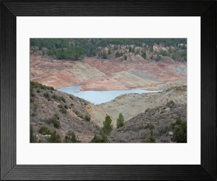 Framed Print : The partially empty Contreras water reservoir is pictured during a severe drought near Framed Print : The partially empty Contreras water reservoir is pictured during a severe drought near
