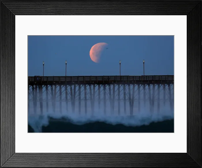 Framed Print : A Blue Moon comes out of a lunar eclipse as it sets past an ocean pier in Oceanside Framed Print : A Blue Moon comes out of a lunar eclipse as it sets past an ocean pier in Oceanside