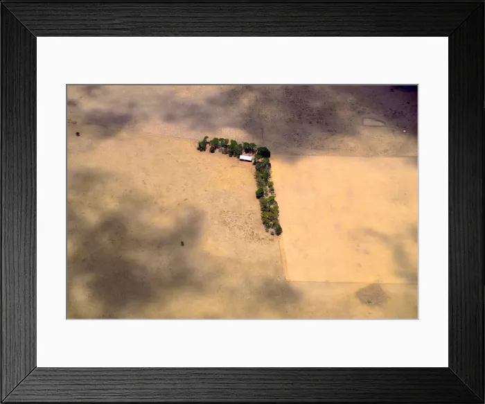 Framed Print : A shed and line of trees can be seen in a paddock on a farm located on the outskirts of Framed Print : A shed and line of trees can be seen in a paddock on a farm located on the outskirts of