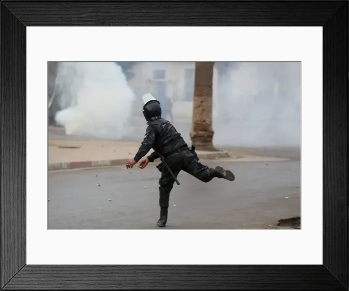 Framed Print : Riot police clash with protesters during demonstrations against rising prices Framed Print : Riot police clash with protesters during demonstrations against rising prices