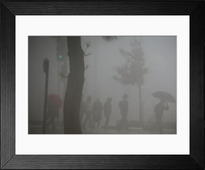 Framed Print : People cross the road on a pedestrian crossing during a foggy day in Jerusalem Framed Print : People cross the road on a pedestrian crossing during a foggy day in Jerusalem