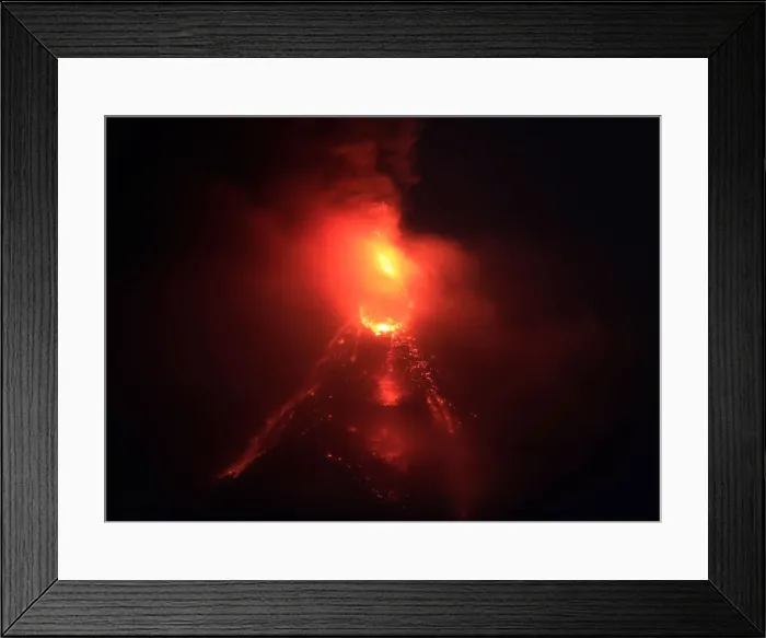 Framed Print : Lava flows from the crater of Mount Mayon Volcano during an eruption in Legazpi city