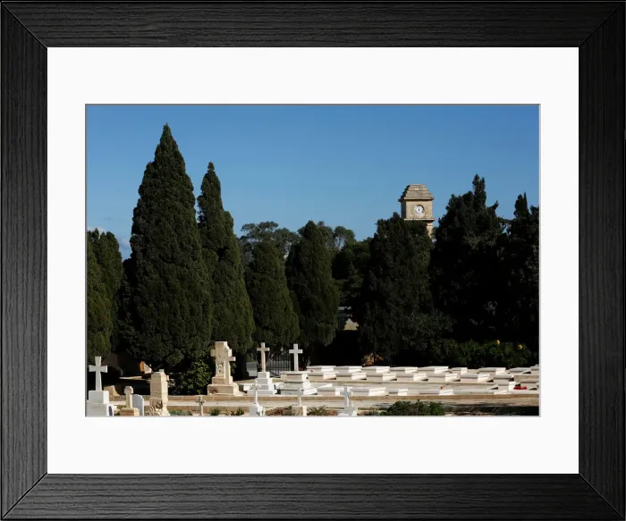 Framed Print : The Saint Patricks Barracks clock tower is seen from the Pembroke Military Cemetery in Framed Print : The Saint Patricks Barracks clock tower is seen from the Pembroke Military Cemetery in
