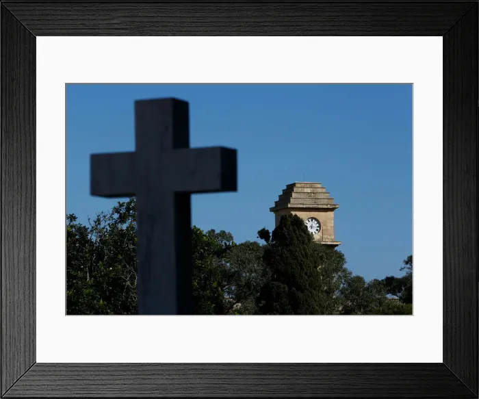 Framed Print : The Saint Patricks Barracks clock tower is seen from the Pembroke Military Cemetery in Framed Print : The Saint Patricks Barracks clock tower is seen from the Pembroke Military Cemetery in