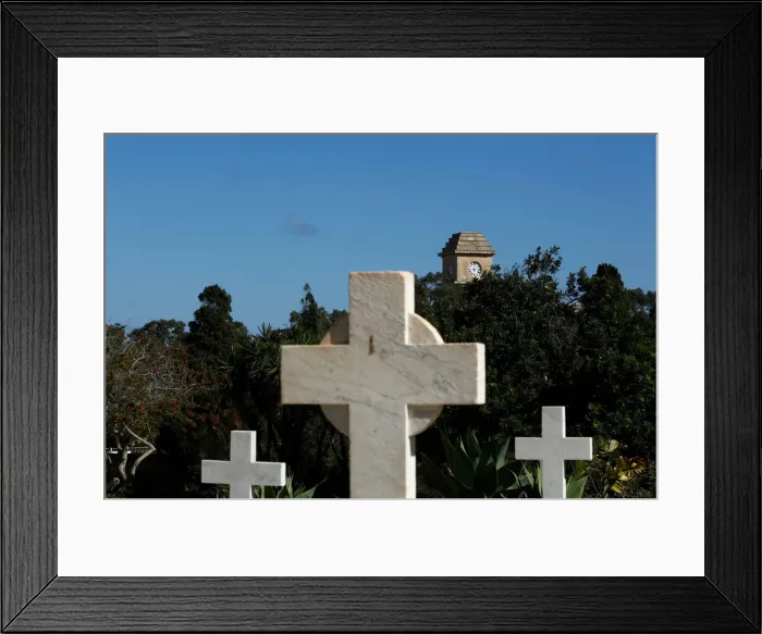 Framed Print : The Saint Patricks Barracks clock tower is seen from the Pembroke Military Cemetery in Framed Print : The Saint Patricks Barracks clock tower is seen from the Pembroke Military Cemetery in