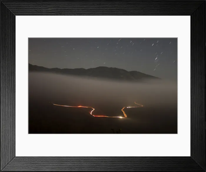 Framed Print : A U. S. border patrol vehicle is seen from the Mexican side of the border while driving in Framed Print : A U. S. border patrol vehicle is seen from the Mexican side of the border while driving in
