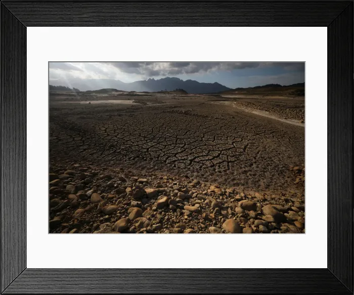 Framed Print : Caked mud is seen at Theewaterskloof dam near Cape Town