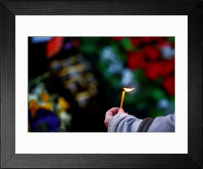 Framed Print : A woman holds a candle during an opposition rally to mark the anniversary of Framed Print : A woman holds a candle during an opposition rally to mark the anniversary of