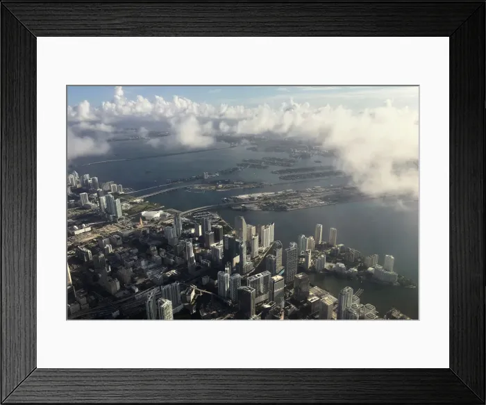 Framed Print : Downtown Miami is pictured in this aerial photo as clouds begin to form in advance of Framed Print : Downtown Miami is pictured in this aerial photo as clouds begin to form in advance of