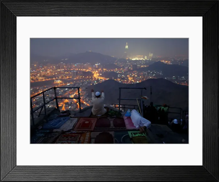Framed Print : A pilgrim prays at Mount Al-Noor ahead of the annual haj pilgrimage in the holy city of Framed Print : A pilgrim prays at Mount Al-Noor ahead of the annual haj pilgrimage in the holy city of