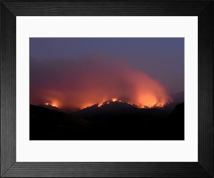 Framed Print : Seen in a long exposure photograph, the Soberanes Fire burns along ridges above Framed Print : Seen in a long exposure photograph, the Soberanes Fire burns along ridges above