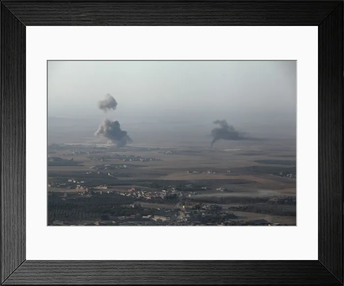 Framed Print : Smoke rises at Islamic State militants positions in the town of Naweran Framed Print : Smoke rises at Islamic State militants positions in the town of Naweran