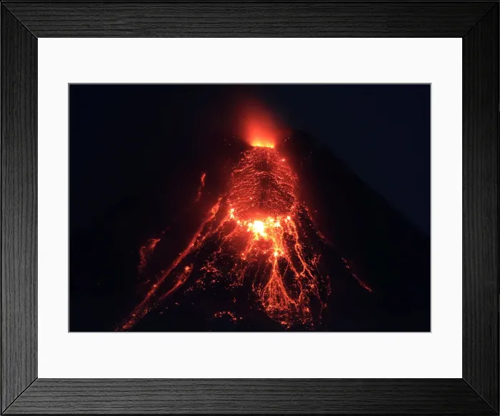 Framed Print : Lava flows from the crater of Mount Mayon Volcano during an eruption in Legazpi city Framed Print : Lava flows from the crater of Mount Mayon Volcano during an eruption in Legazpi city