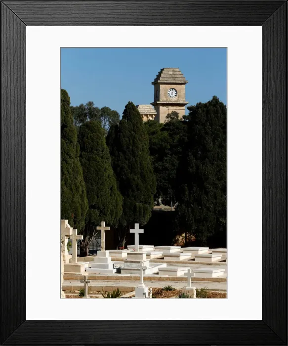 Framed Print : The Saint Patricks Barracks clock tower is seen from the Pembroke Military Cemetery in Framed Print : The Saint Patricks Barracks clock tower is seen from the Pembroke Military Cemetery in