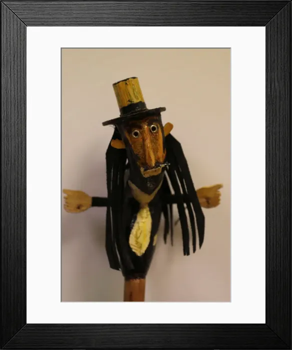 Framed Print : A figure on the top of a stick used by a believer is seen before the Endiablada Framed Print : A figure on the top of a stick used by a believer is seen before the Endiablada
