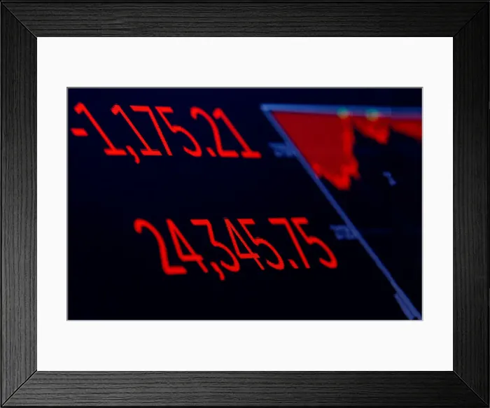Framed Print : A screen displays the Dow Jones Industrial Average following the closing bell on Framed Print : A screen displays the Dow Jones Industrial Average following the closing bell on