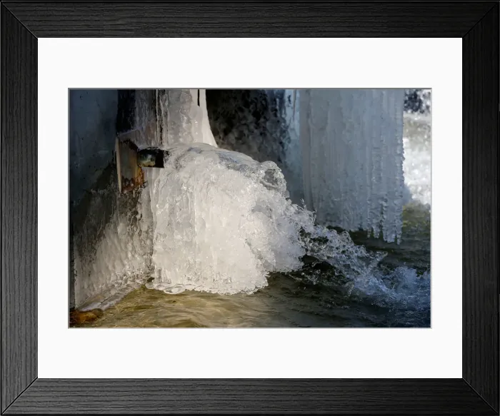 Framed Print : Ice partially covers a fountain on a cold winter day in central Brussels Framed Print : Ice partially covers a fountain on a cold winter day in central Brussels