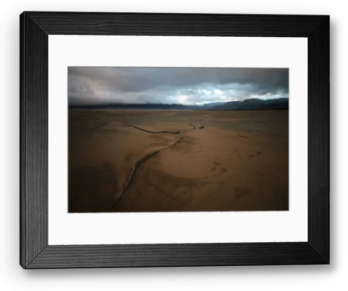 Framed Print : Sand blows across a normally submerged area at Theewaterskloof dam near Cape Town