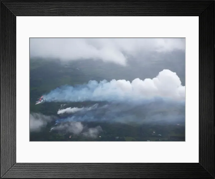 Framed Print : Smoke and steam rise from a fissure east of the Leilani Estates subdivision during Framed Print : Smoke and steam rise from a fissure east of the Leilani Estates subdivision during