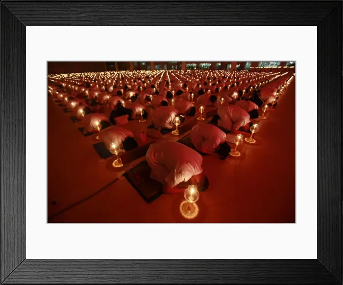 Framed Print : Thousands of Thais and Buddhist monks light candles as they pray for Japans earthquake Framed Print : Thousands of Thais and Buddhist monks light candles as they pray for Japans earthquake