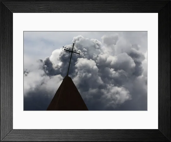 Framed Print : A cross is seen atop a church steeple as ash from Mount Sinabung spews in the background
