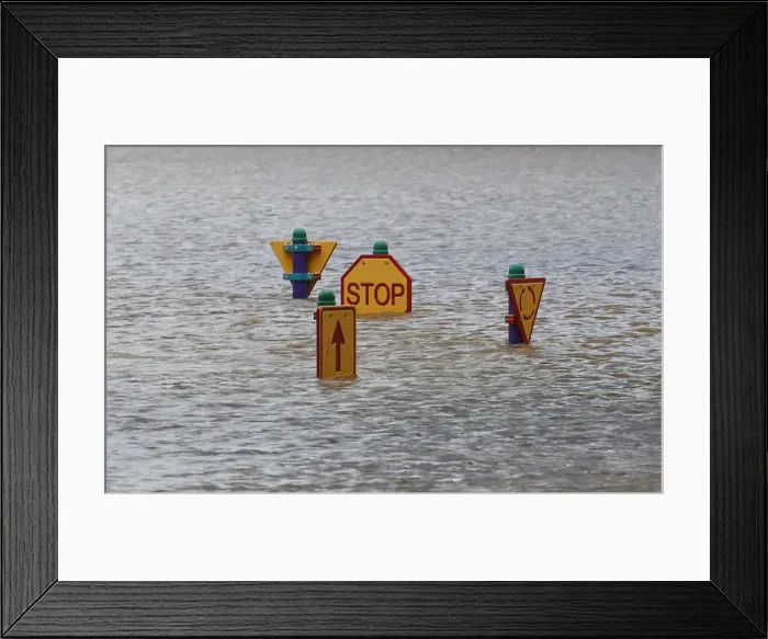 Framed Print : A play ground affected by flooded waters is seen in Bundaberg, Queensland