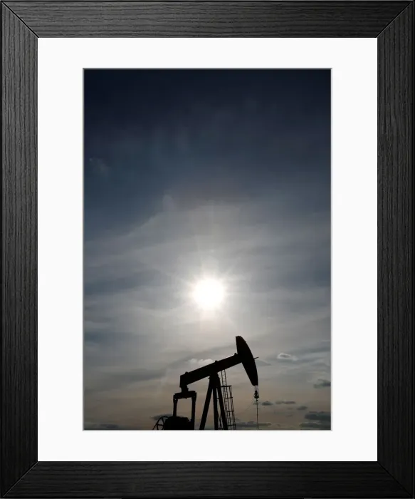 Framed Print : An oil pump is seen at sunset outside Vaudoy-en-Brie