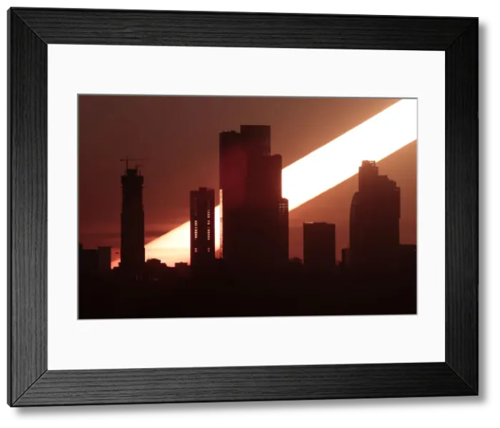Framed Print : The sun rises behind the skyscrapers of the Moscow International Business Centre in Framed Print : The sun rises behind the skyscrapers of the Moscow International Business Centre in