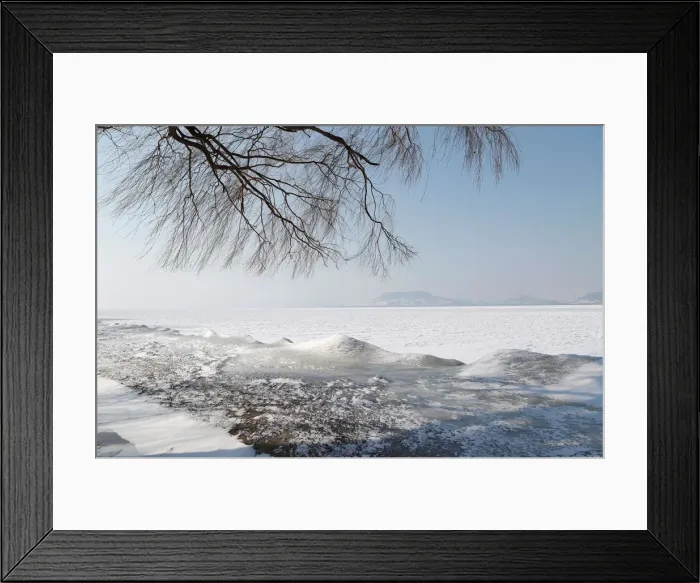 Framed Print : Frozen Lake Balaton is seen during a winter day in Fonyod Framed Print : Frozen Lake Balaton is seen during a winter day in Fonyod