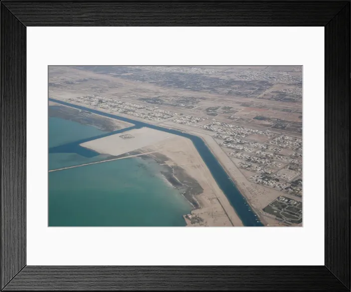 Framed Print : An aerial view of Arabian Gulf with city of Abu Dhabi is pictured through the window of Framed Print : An aerial view of Arabian Gulf with city of Abu Dhabi is pictured through the window of