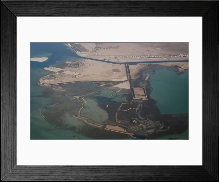 Framed Print : An aerial view of Arabian Gulf with city of Abu Dhabi is pictured through the window of Framed Print : An aerial view of Arabian Gulf with city of Abu Dhabi is pictured through the window of