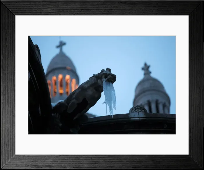 Framed Print : Icicles hang from a gargoyle on the Sacre Coeur basilica at the Butte Montmartre in Paris Framed Print : Icicles hang from a gargoyle on the Sacre Coeur basilica at the Butte Montmartre in Paris