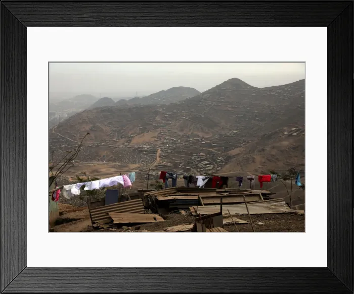 Framed Print : Huts and houses are seen on the hills of Nueva Esperanza ( New Hope