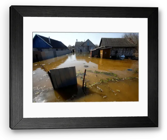 Framed Print : A flooded courtyard is seen as water from the Neman river overflows its banks during Framed Print : A flooded courtyard is seen as water from the Neman river overflows its banks during