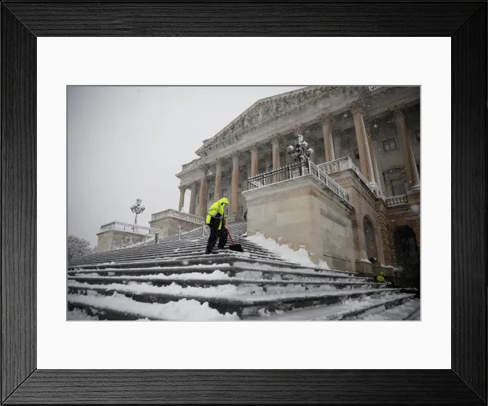 Framed Print : Workers clear the steps of the House of Representatives on Capitol Hill in Washington