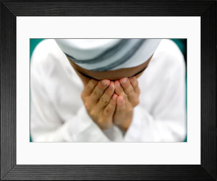 Framed Print : Muslim boy performs prayers on the first Friday of the holy fasting month of Ramadan Framed Print : Muslim boy performs prayers on the first Friday of the holy fasting month of Ramadan