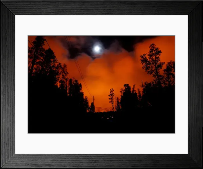Framed Print : A lava flow from the Kilauea volcano illuminated the night sky